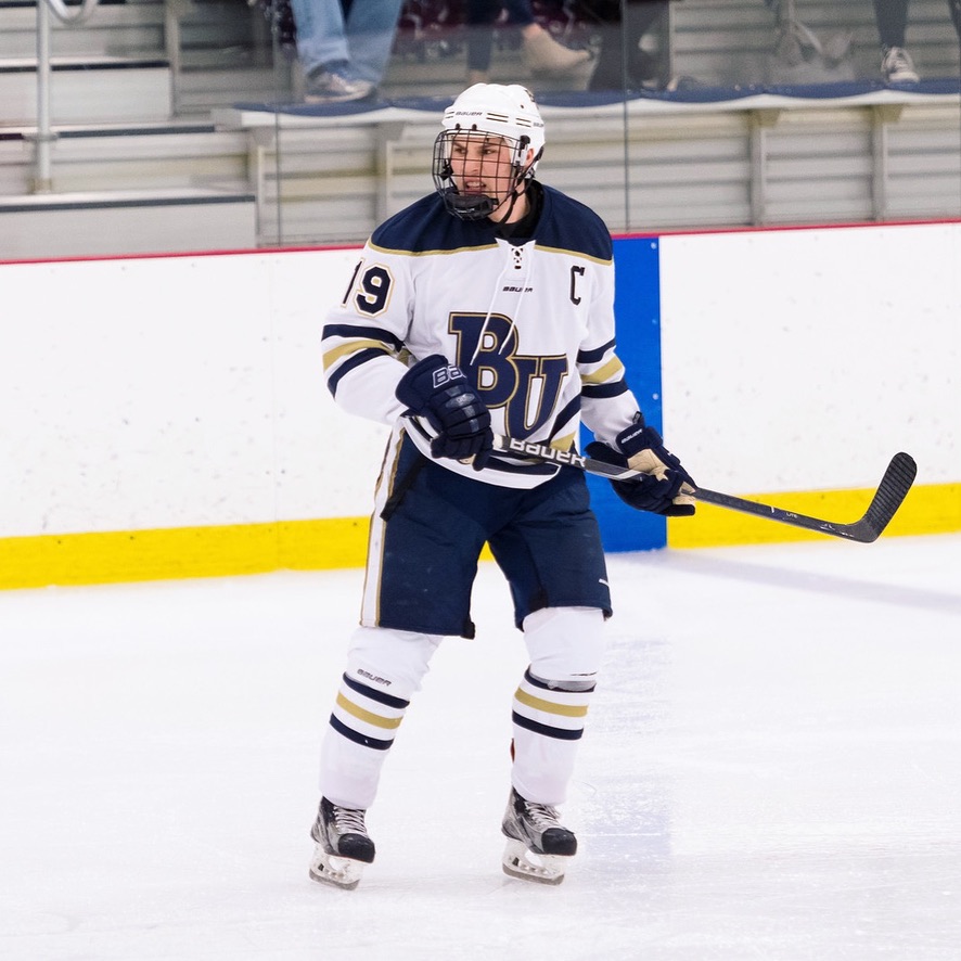 Justin Bonanno wearing the captain's C for the Bethel University hockey team