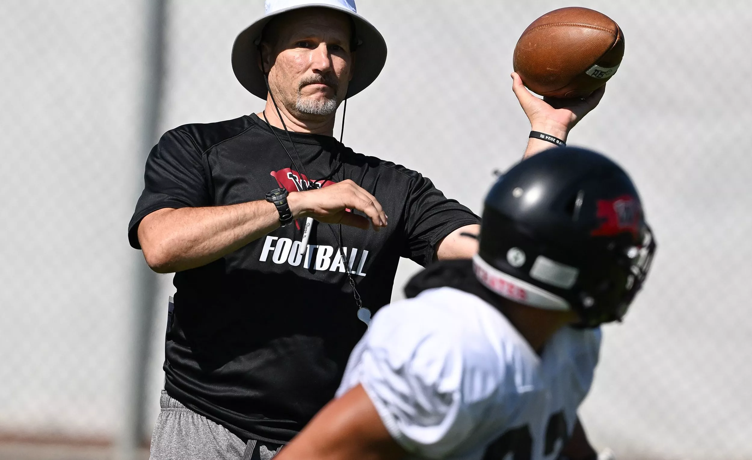 Rod Sandberg coaching Whitworth football practice