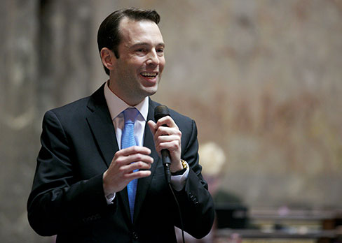Andy Billig speaking at a podium